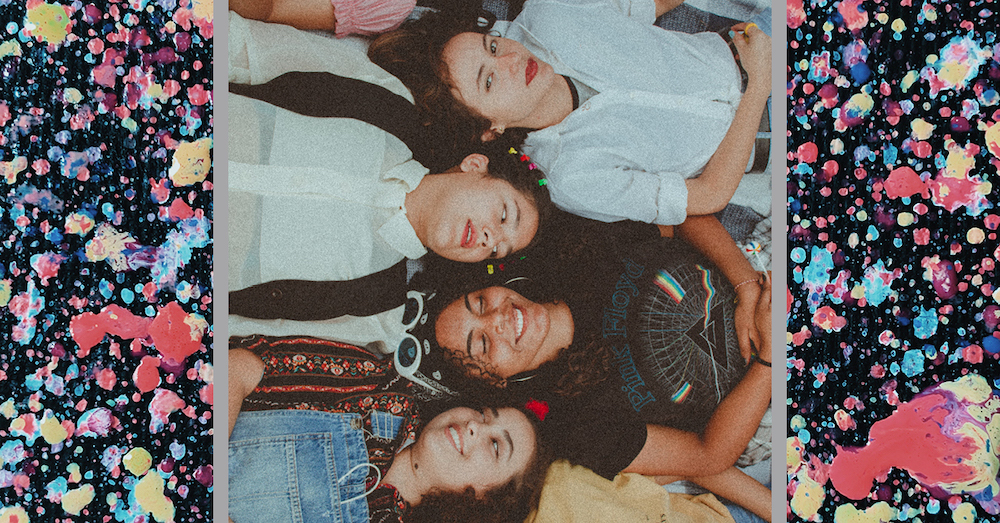 Image of 4 young people laying next to each other