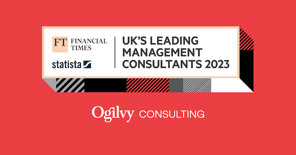 Ogilvy Consulting Named in FT’s Top Management Consultants 2023 on red background with Ogilvy Consulting Logo