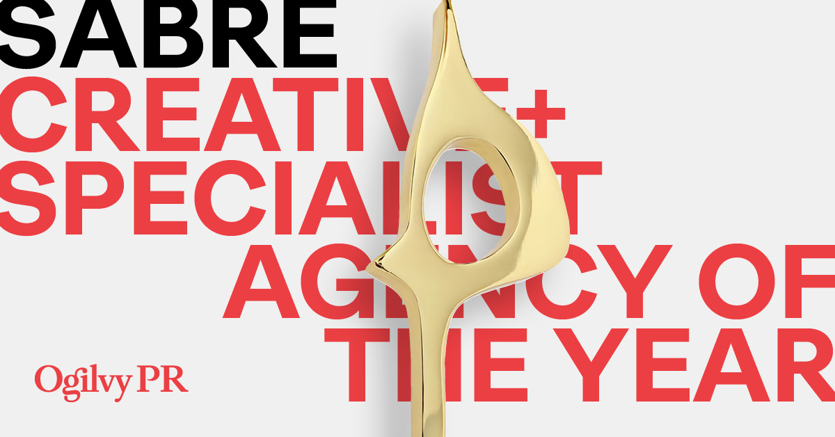 White background graphic with black caps copy that says "SABRE" and red caps copy that says "Creative + Specialist Agency of the Year". There is an Ogilvy PR logo in the bottom left corner. A SABRE Award is overlaid on the copy.