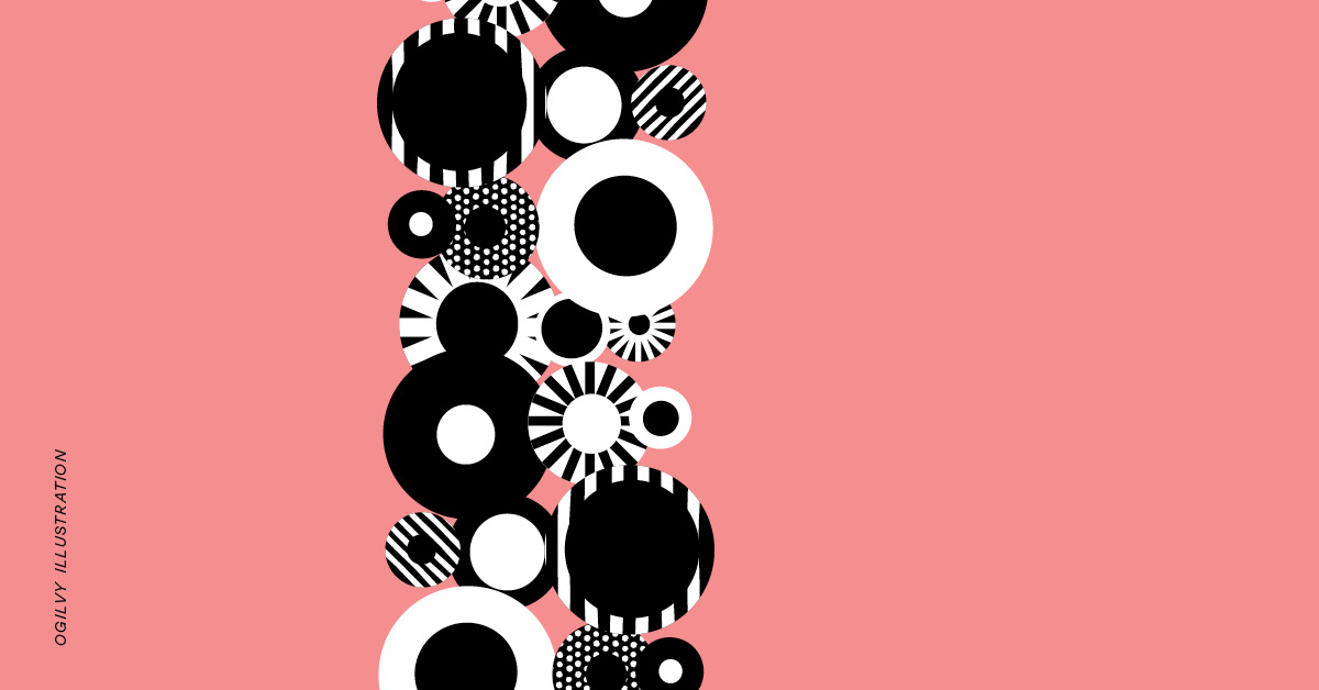 White and black patterned circles stacked vertically against a pink background