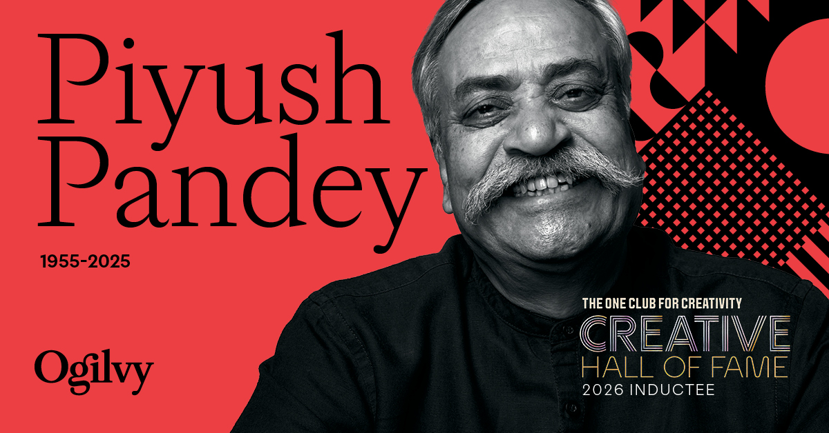 Black and white portrait of Piyush Pandey (1955–2025), smiling warmly, set against a bold red background with geometric shapes, alongside the Ogilvy logo and text reading "The One Club for Creativity Creative Hall of Fame, 2026 Inductee."