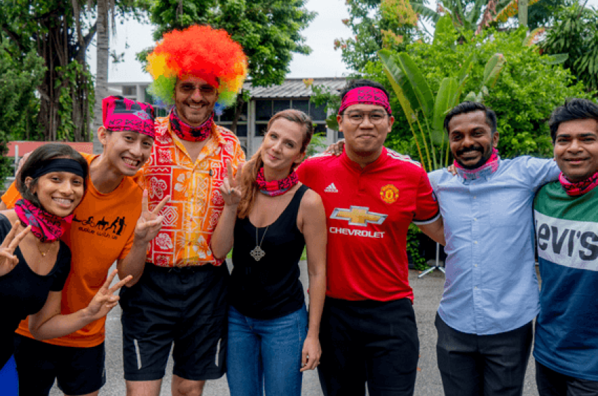 Group photo of an affinity-based community at an off-site outing.