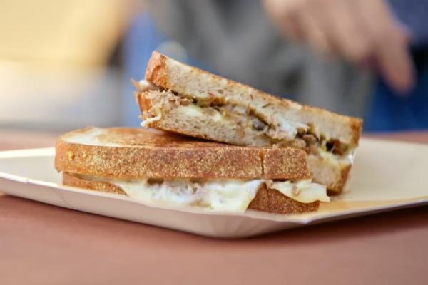 Grilled cheese sandwich on a beige plate