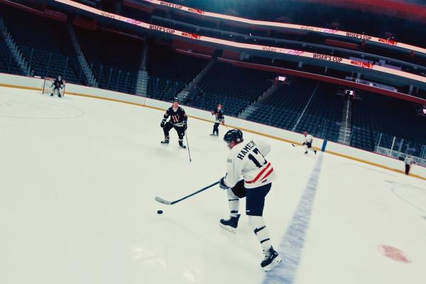 Youth hockey players playing hockey in Little Caesars Arena in Detroit, MI