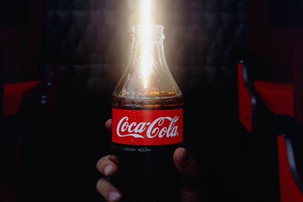 Lightsaber light coming out of a coca cola bottle