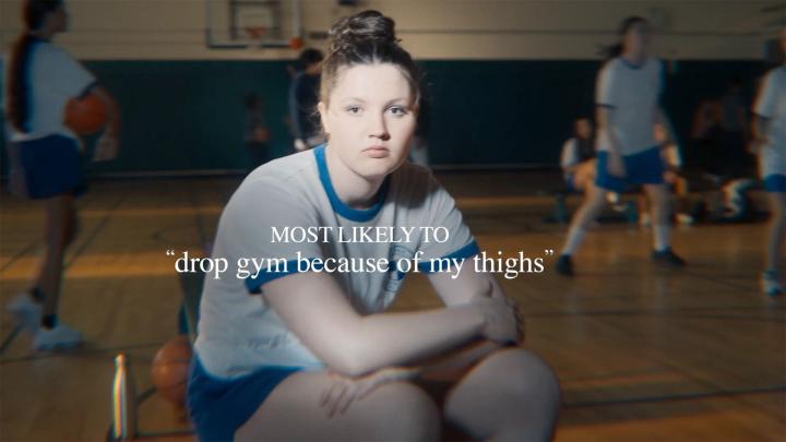 Most Likely To — Dove Girl sitting in gym class, white overlay text "Most likely to drop gym because of my thighs"