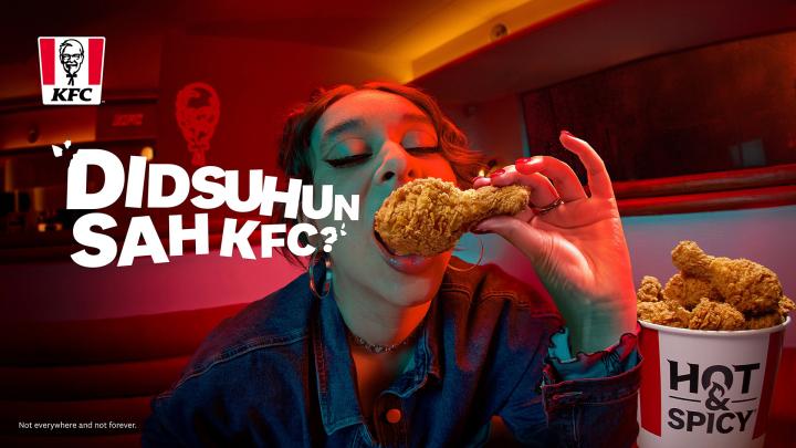 The Flavour Has Spoken — KFC Person eating KFC chicken with bold white copy "DIDSUHMSAH KFC?"
