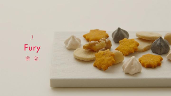Edible Literature — Kameya Yoshinaga board with assorted wagashi. on the left the word "Fury"