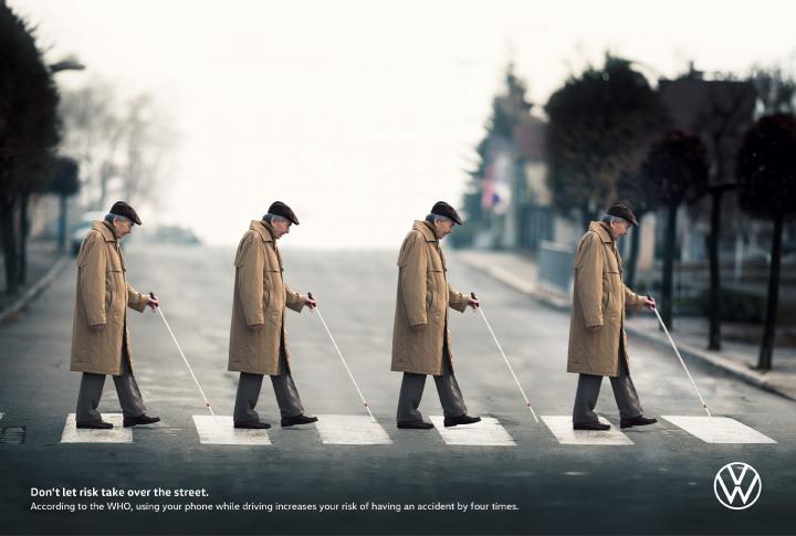 X4 - Volkswagen Four time Repeating image of an elderly man with a walking stick crossing a street in a crosswalk