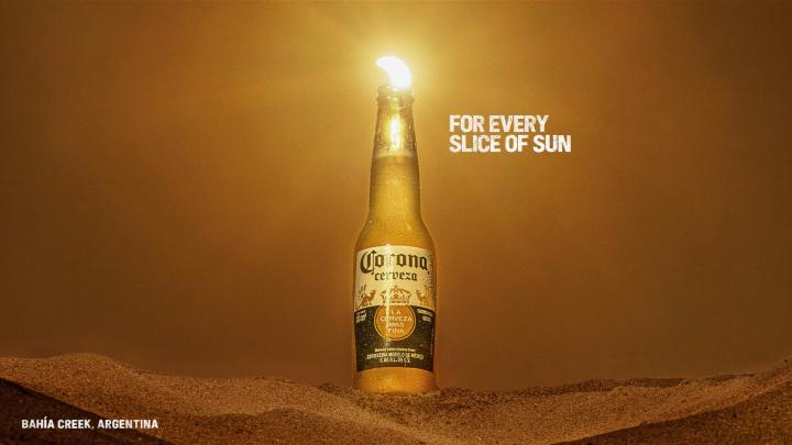 For Every Sunset — Corona Eclipse sun appearing as a lime wedge in a Corona bottle, with copy "For Every Slice of Sun"