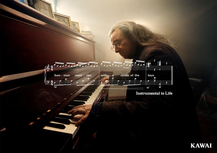 Instrumental to Life — Kawai Older man playing piano. There is a white graphic of sheet music superimposed over the image