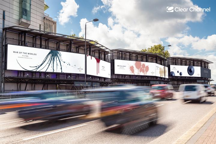 Image of Dulux Heritage Editions ads along a highway with cars passing by. Covers featuring Dulux paint for the novels Dracula, War of the Worlds, Mrs Dalloway and 1984 