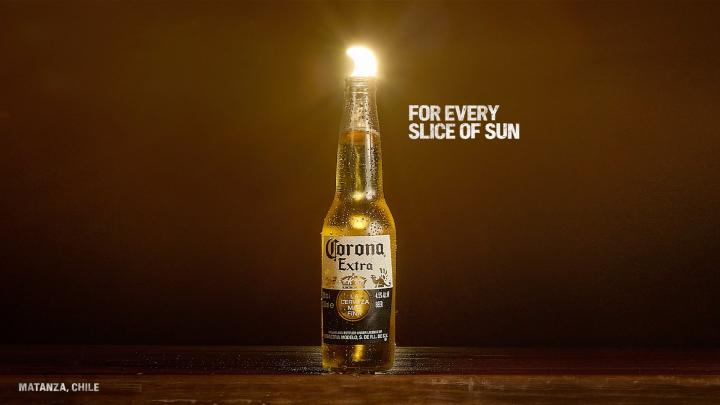 For Every Sunset — Corona Eclipse sun appearing as a lime wedge in a Corona bottle, with copy "For Every Slice of Sun"