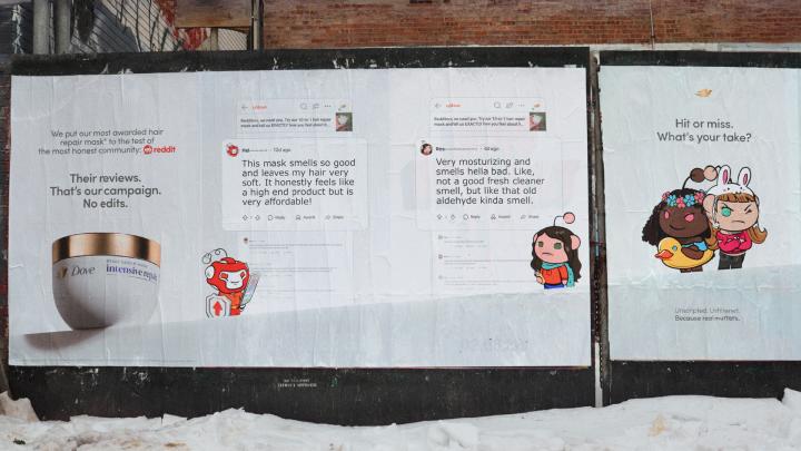 A wide shot of several large outdoor posters on a wall, promoting a Dove hair product using Reddit user reviews and Reddit avatars. Text on the posters includes "Their reviews. That's our campaign. No edits." and "Hi or miss. What's your take?".