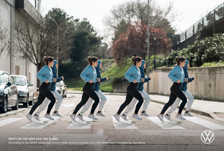 X4 - Volkswagen Four time Repeating image of two people jogging crossing a street in a crosswalk