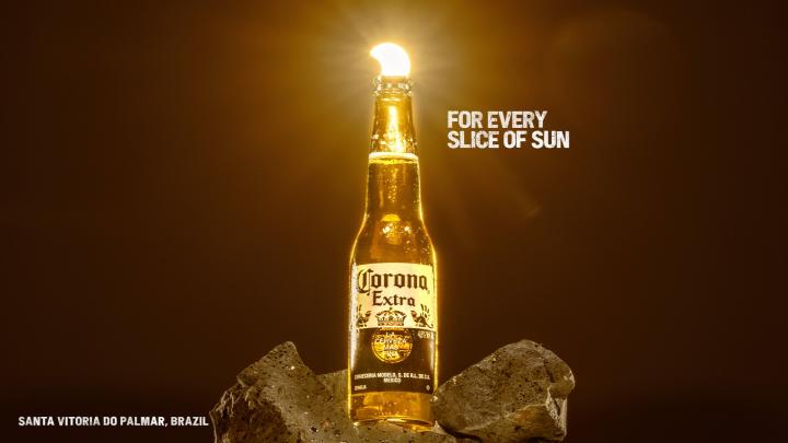 For Every Sunset — Corona Eclipse sun appearing as a lime wedge in a Corona bottle, with copy "For Every Slice of Sun"