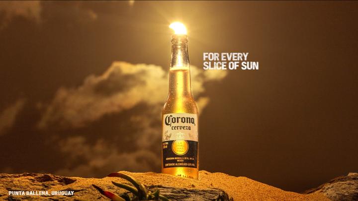 For Every Sunset — Corona Eclipse sun appearing as a lime wedge in a Corona bottle, with copy "For Every Slice of Sun"