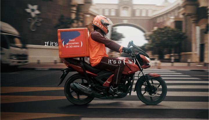 Honda Delivers — Al-Futtaim Trading Enterprises Honda Person on Honda motorbike making a delivery. Copy that says "If its: (your groceries in 30 minutes)" and "It's a" with parenthases marks around the Honda logo on the motorcycle