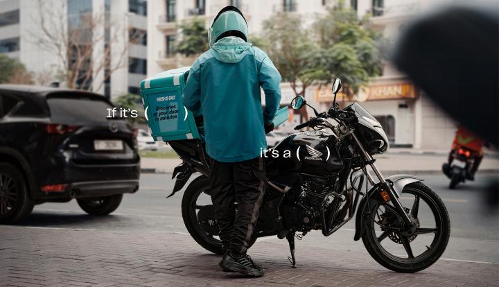 Honda Delivers — Al-Futtaim Trading Enterprises Honda Person on Honda motorbike making a delivery. Copy that says "If its: (Quik)" and "It's a" with parenthases marks around the Honda logo on the motorcycle
