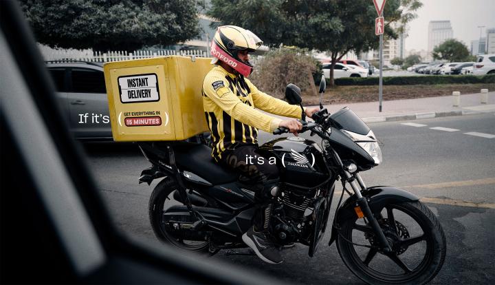 Honda Delivers — Al-Futtaim Trading Enterprises Honda Person on Honda motorbike making a delivery. Copy that says "If its: (your groceries in 30 minutes)" and "It's a" with parenthases marks around the Honda logo on the motorcycle