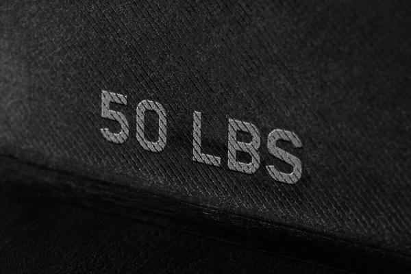 Black background with "50 LBS" in grey type