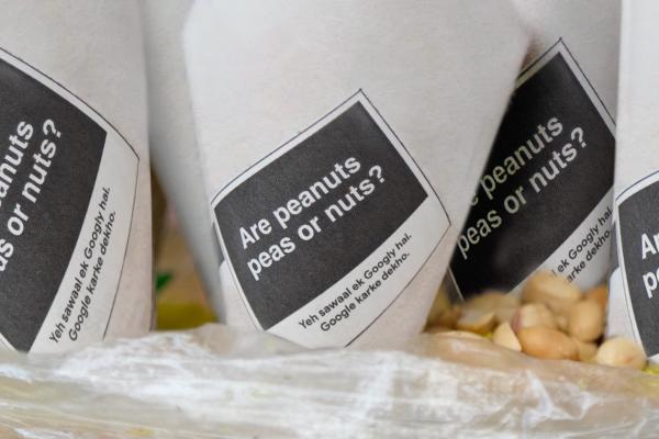Paper wrappers that say "are peanuts nuts?"