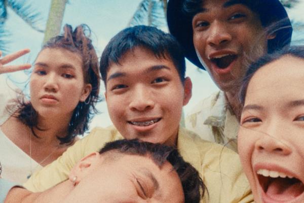 Young Singaporean people posing together and smiling