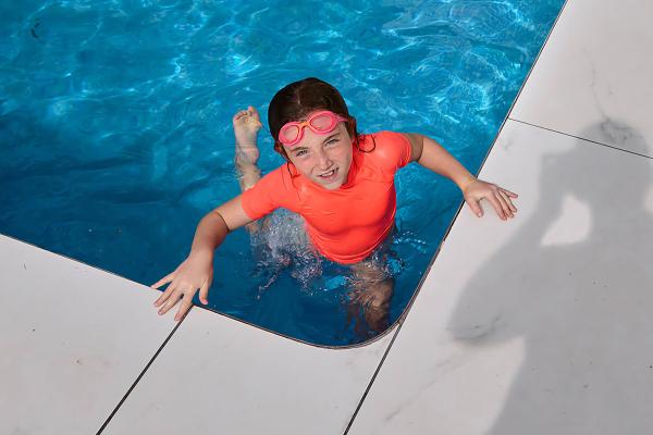 Happy child in a swimming pool