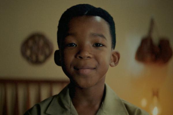 Close up of a young Black South African boy smiling 