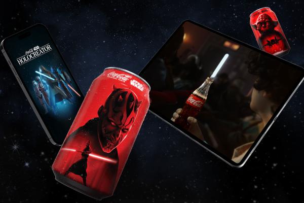 A red Coca-Cola can with Darth Maul, a smartphone, a tablet, and a smaller Coca-Cola can with Yoda are arranged against a starry, dark blue background.
