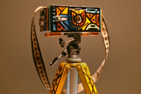 the South Africam - a specially developed camera made entirely with materials from the country and decorated in traditional art. The pinhole camera features South African colors and designs and local materials: the case from Cape Beech wood, the lens from scrap metal, and the strap from cork leather. 