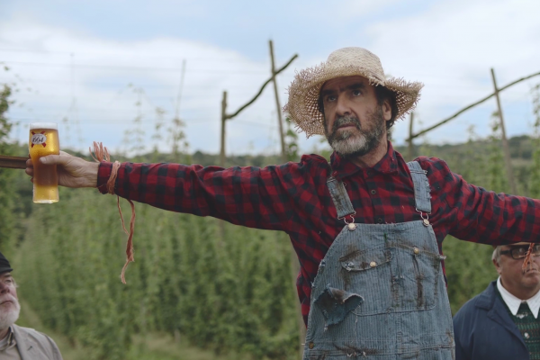 Man in dungerees in field 