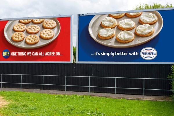 Red and blue roadside billboards for Philadelphia and Ritz Crackers